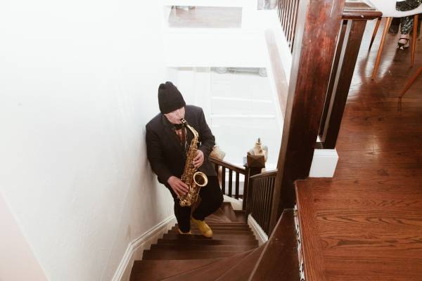 Playing Sax on Stairs