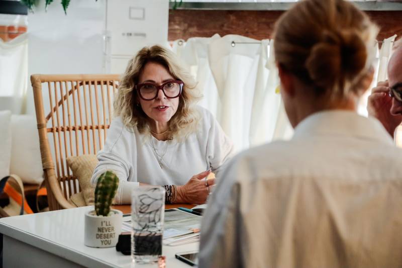 Clothing Manufacturer in Los Angeles answering a client's questions