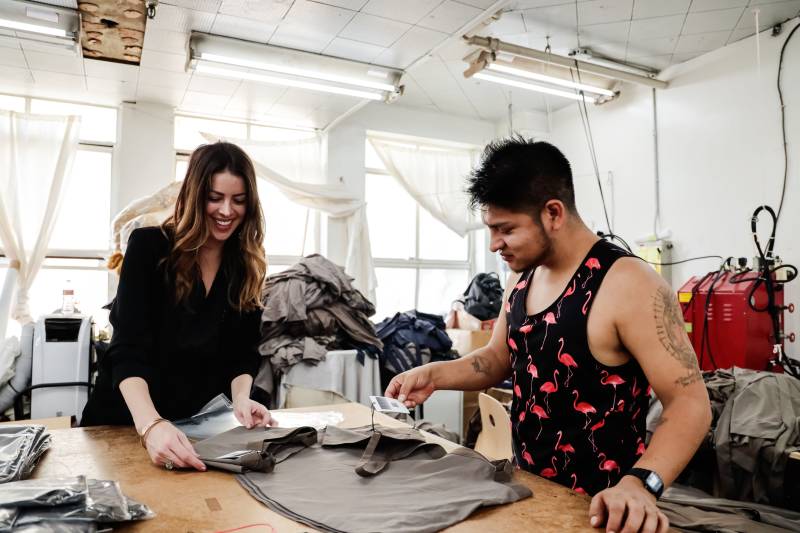 Clothing manufacturing experts working on a project