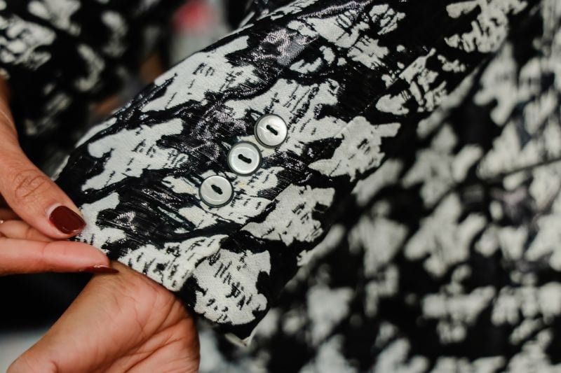 close up of the buttons of a jacket