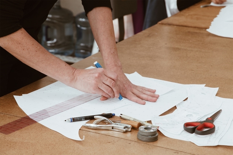 Man drafting a pattern on paper