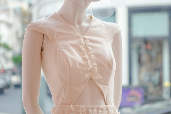 closeup of pink couture dress on mannequin
