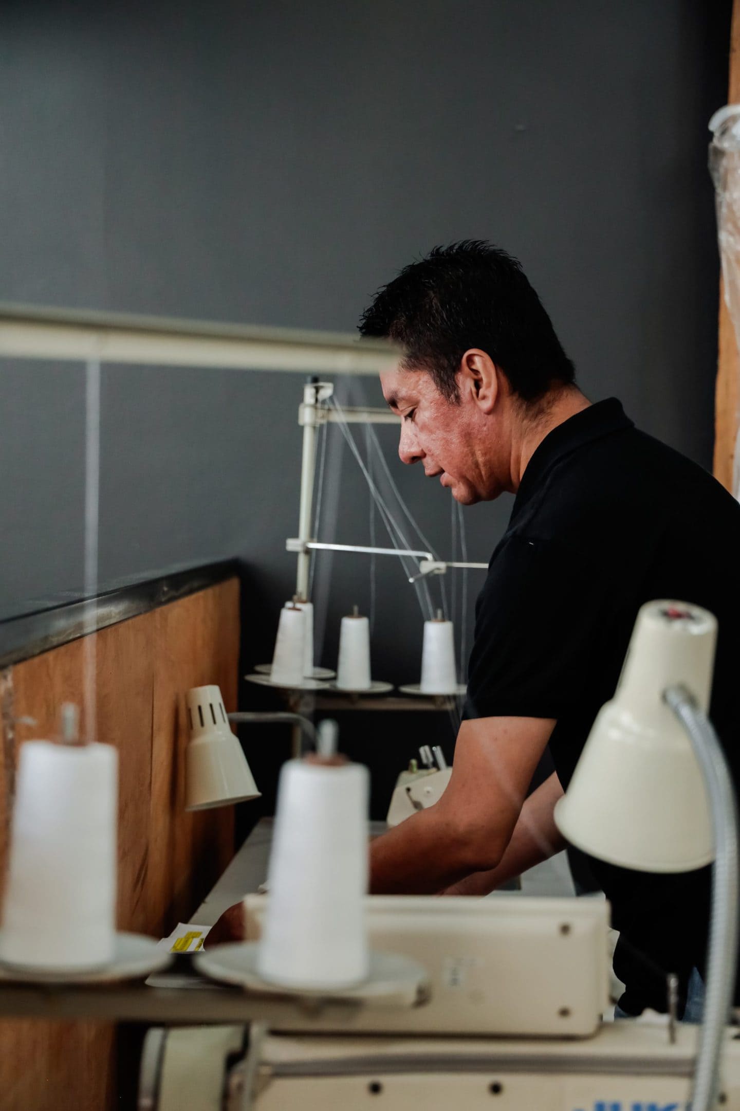 Clothing manufacturer creating garments from dyed textiles