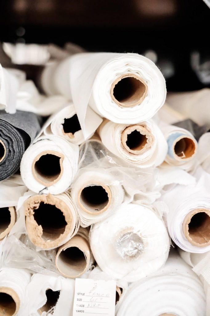 reams of white natural fiber fabric