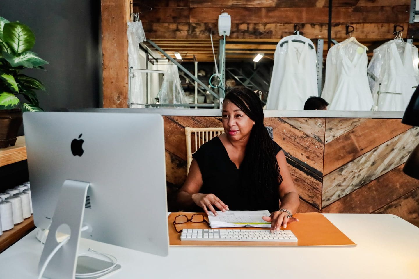fashion designer researching textile dyeing methods on the computer