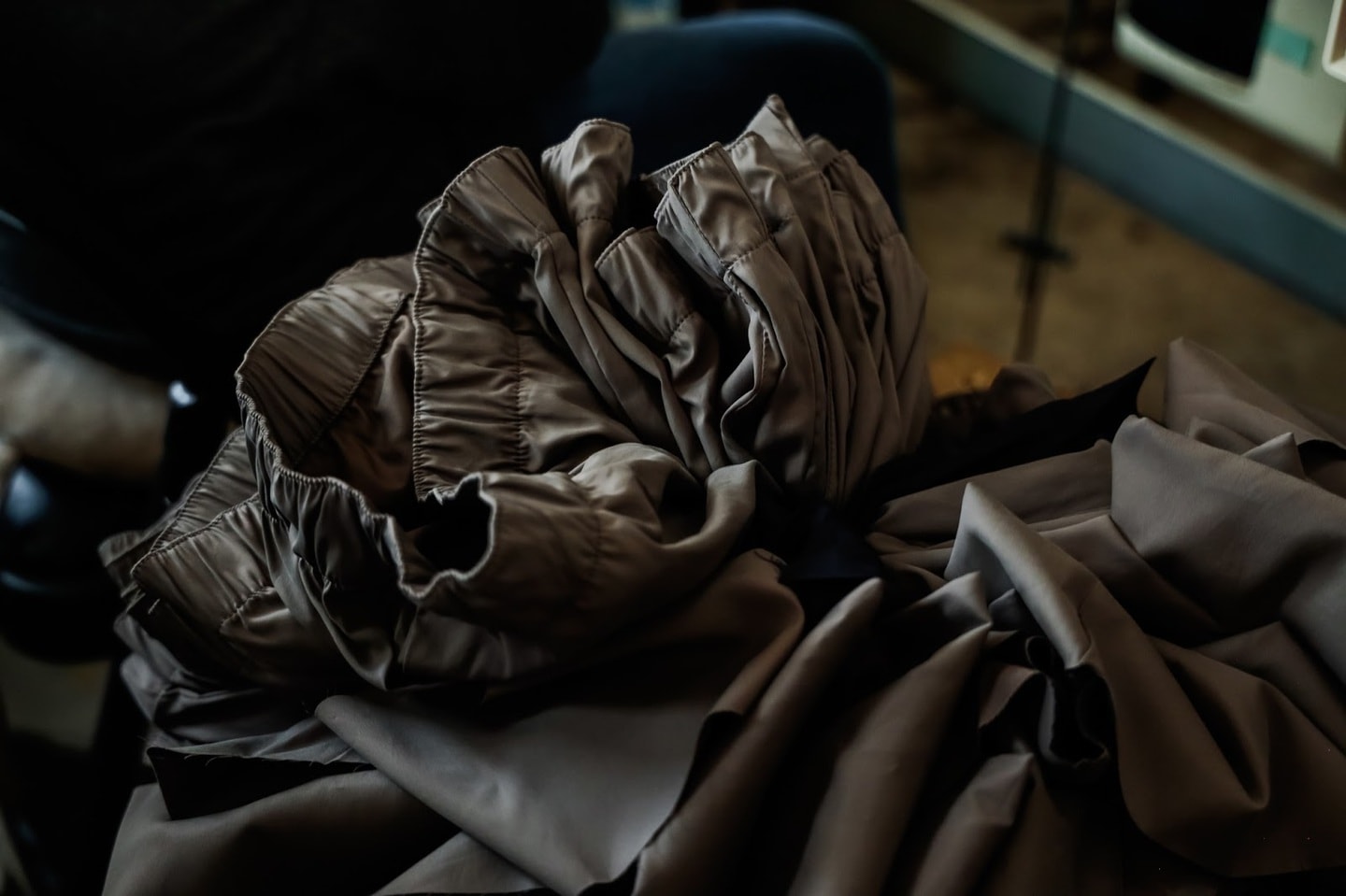 Closeup of a pile of dark sustainable fabric