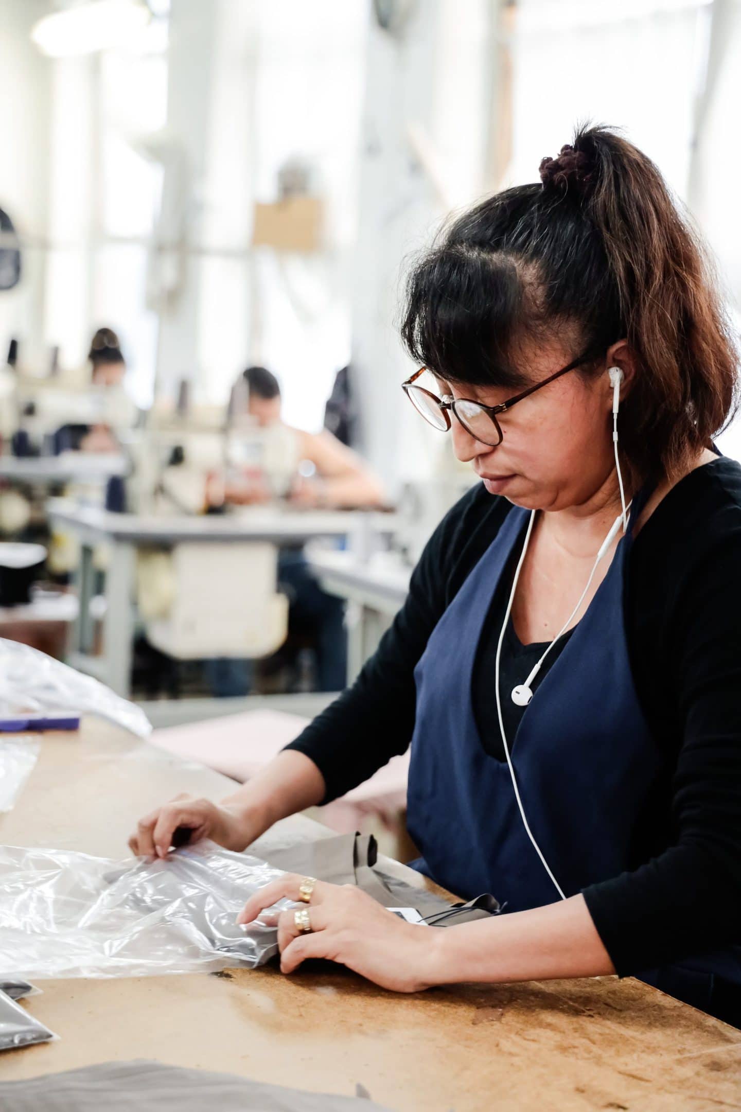 A Los Angeles seamstresses working on wrapping up sustainable fashion items