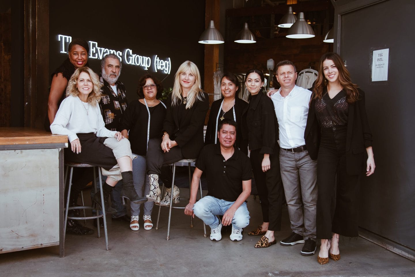 Group shot of the cut and sew services team at The Evans Group inside the Los Angeles clothing manufacturing studio
