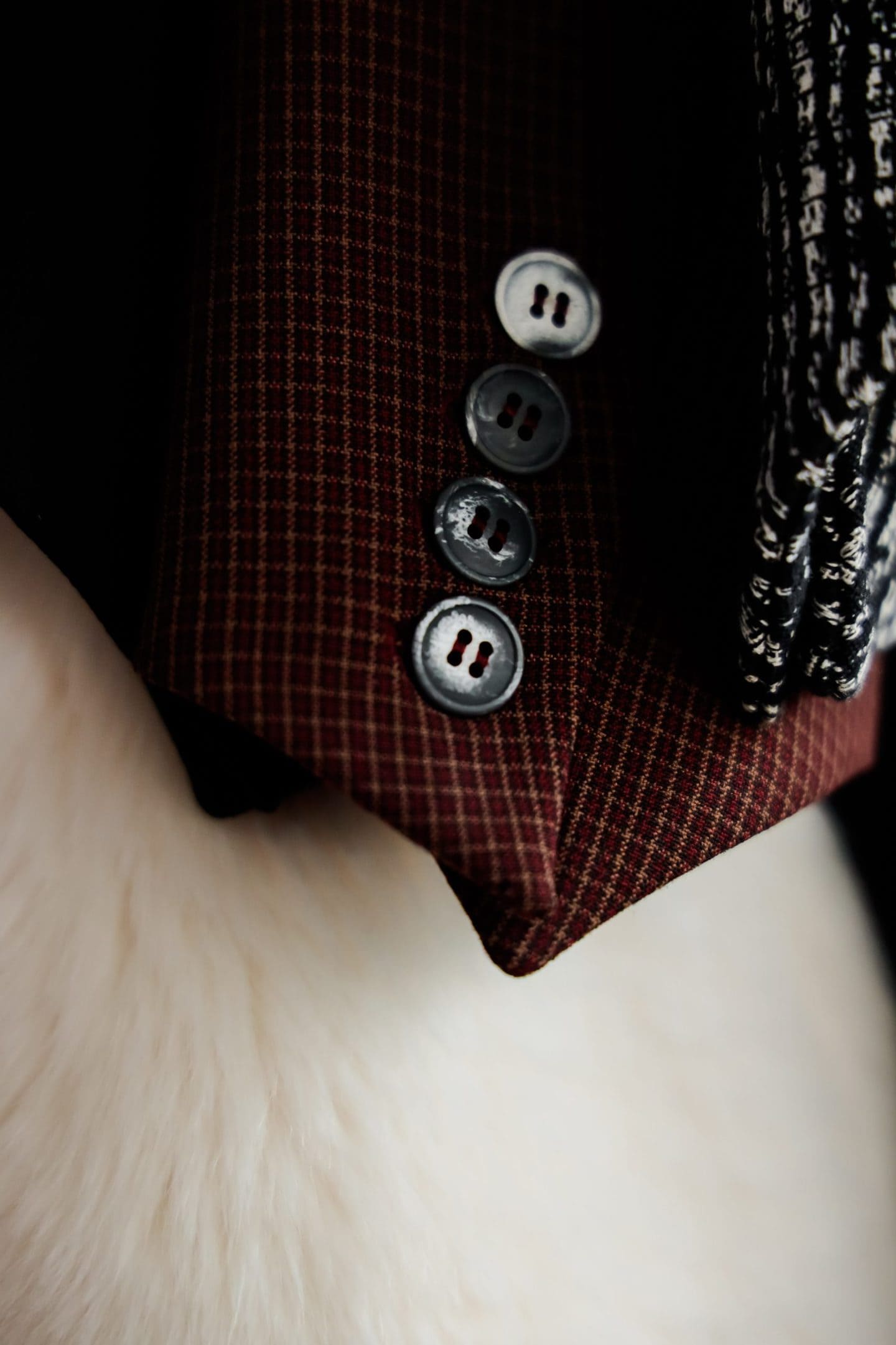 Closeup of a dark red clothing item crafted by cut and sew manufacturers