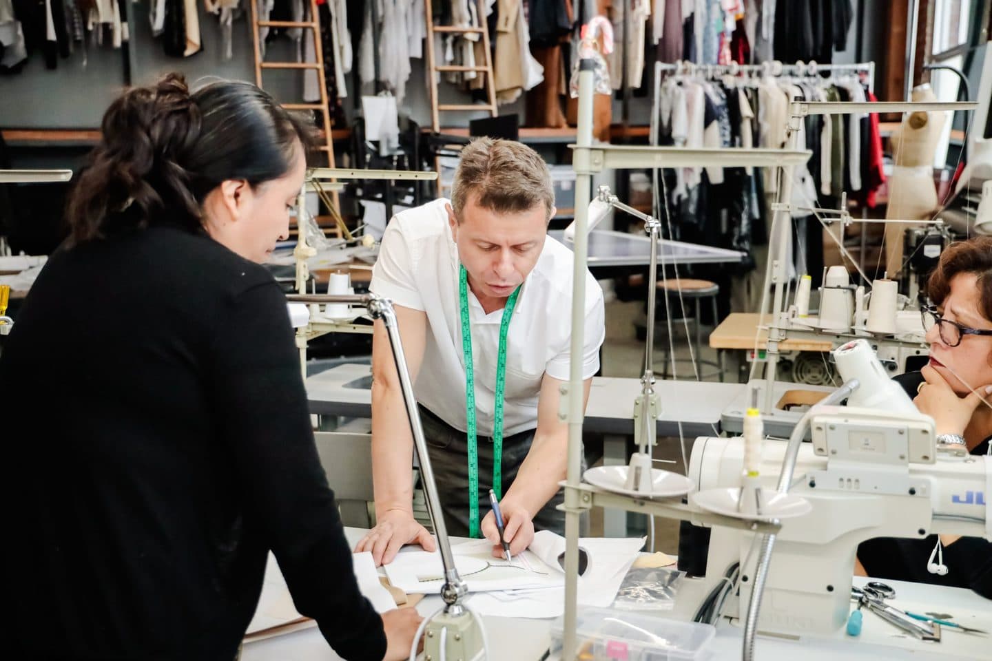 Pattern maker and seamstress discussing a design