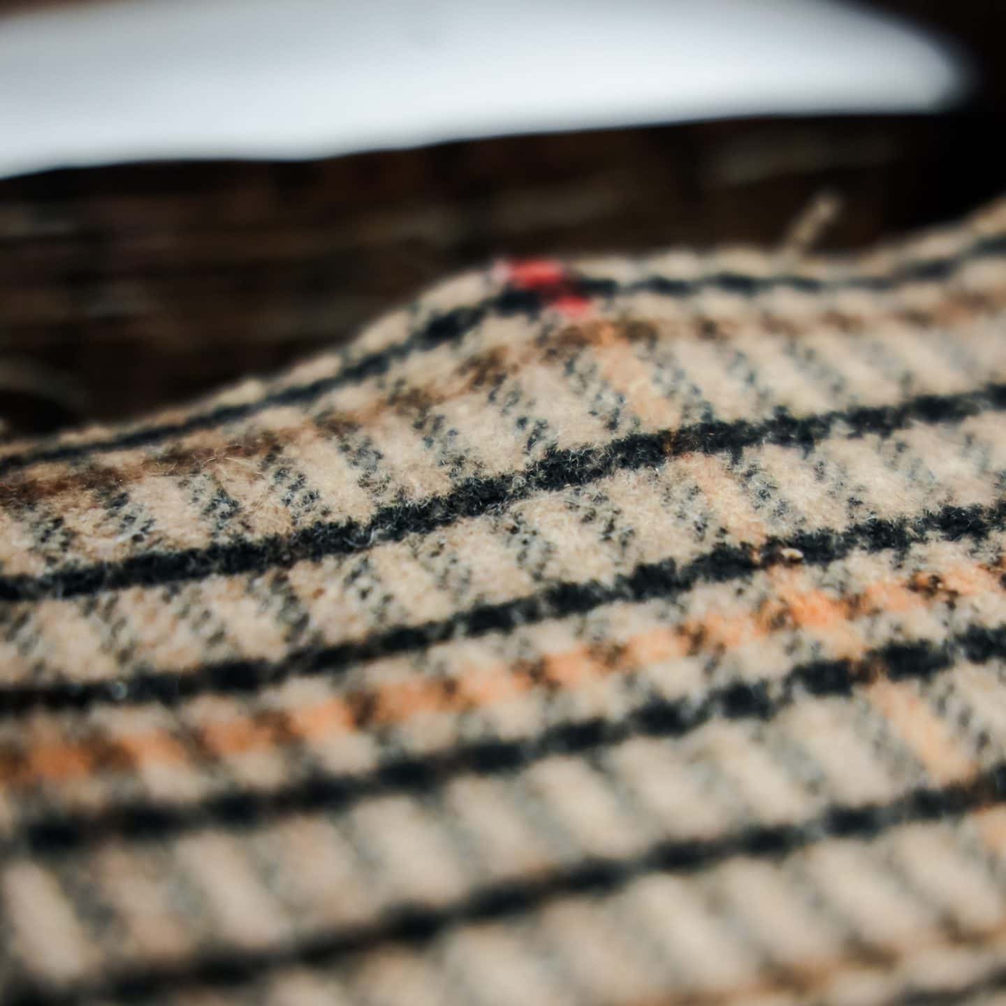 Thick cream-colored striped fabric used for custom fashion in winter