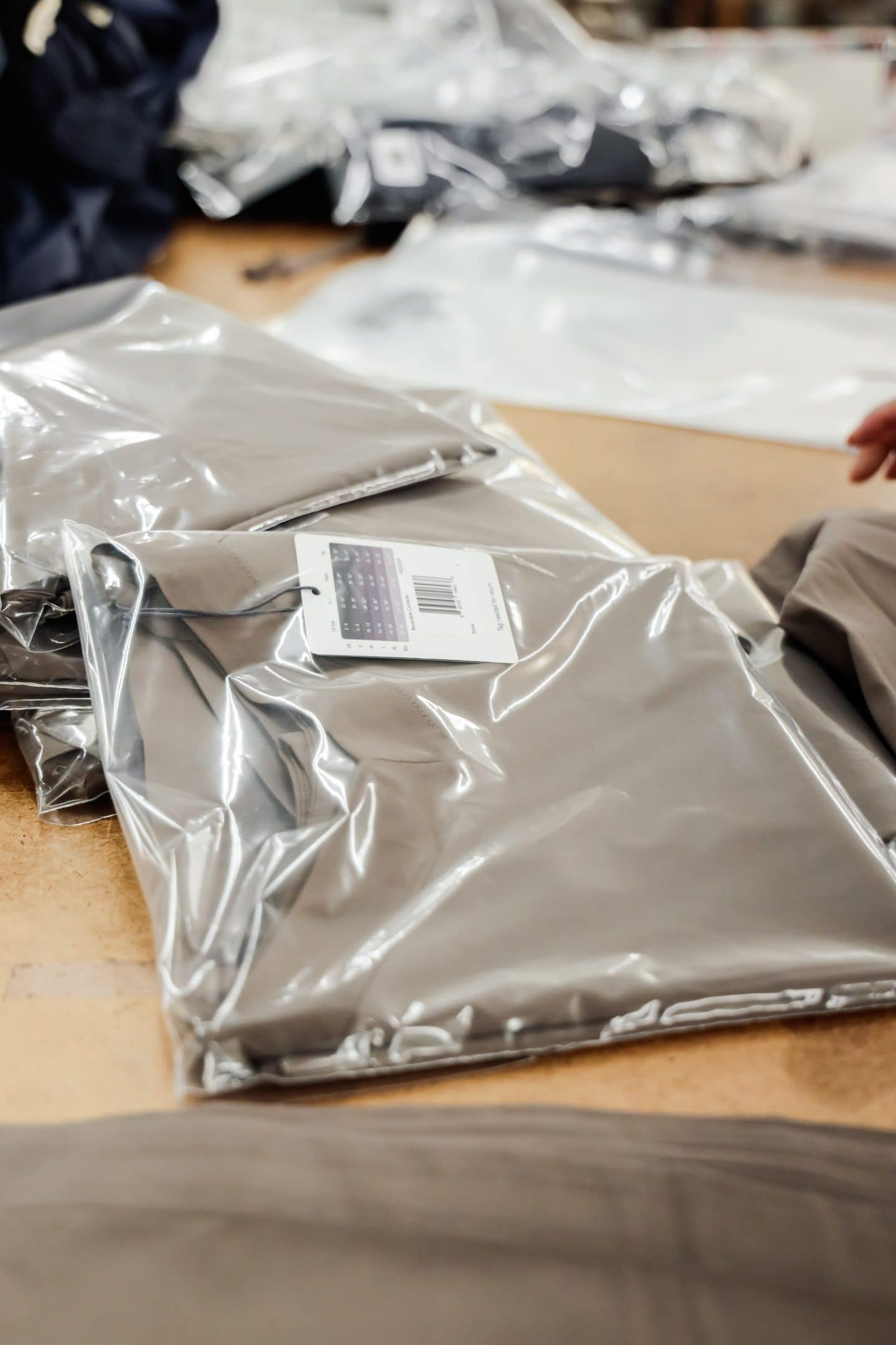stack of wrapped brown clothing in a fashion collection