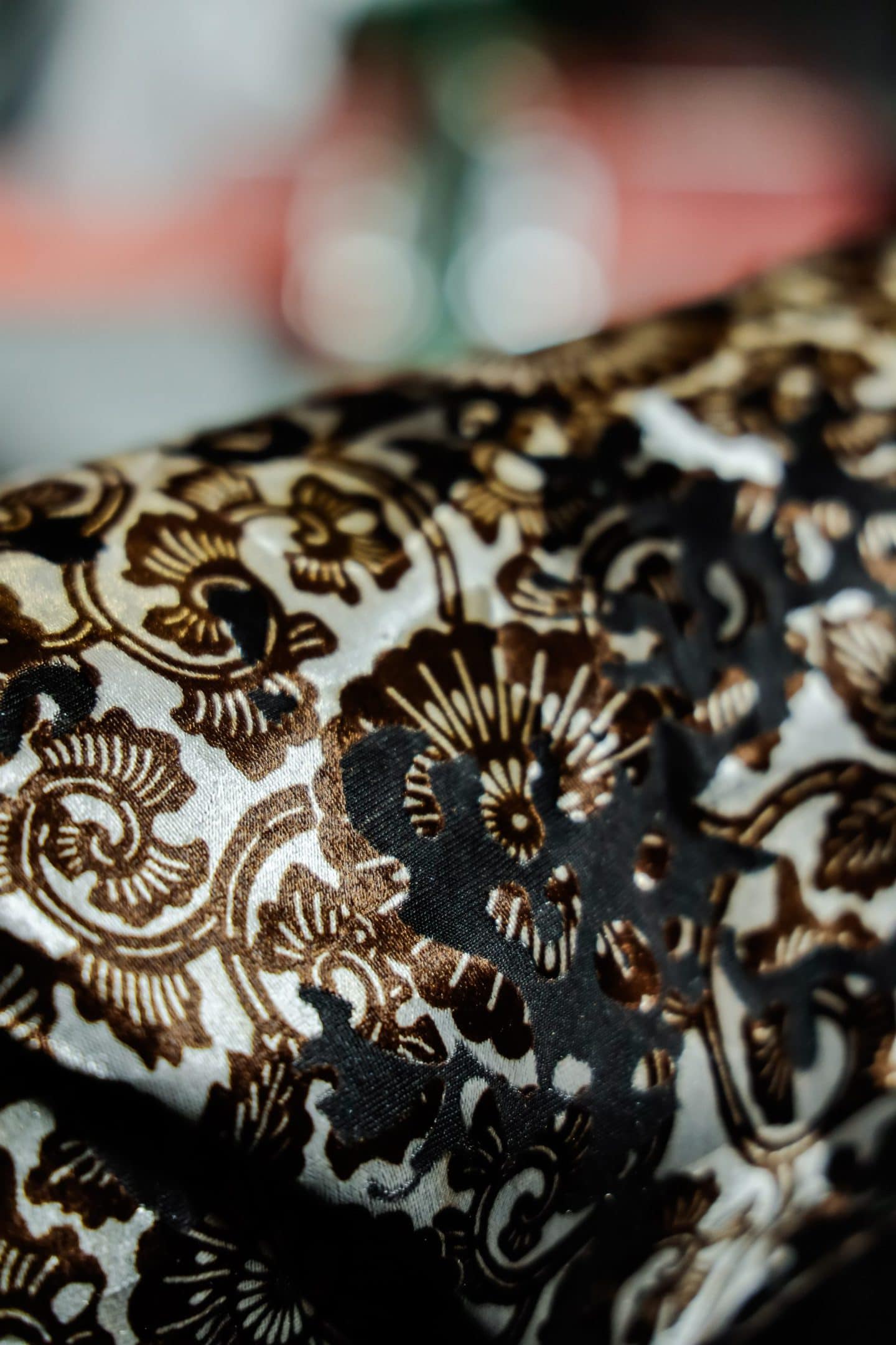 closeup of detailed white, black, and brown fabric design used by pattern makers