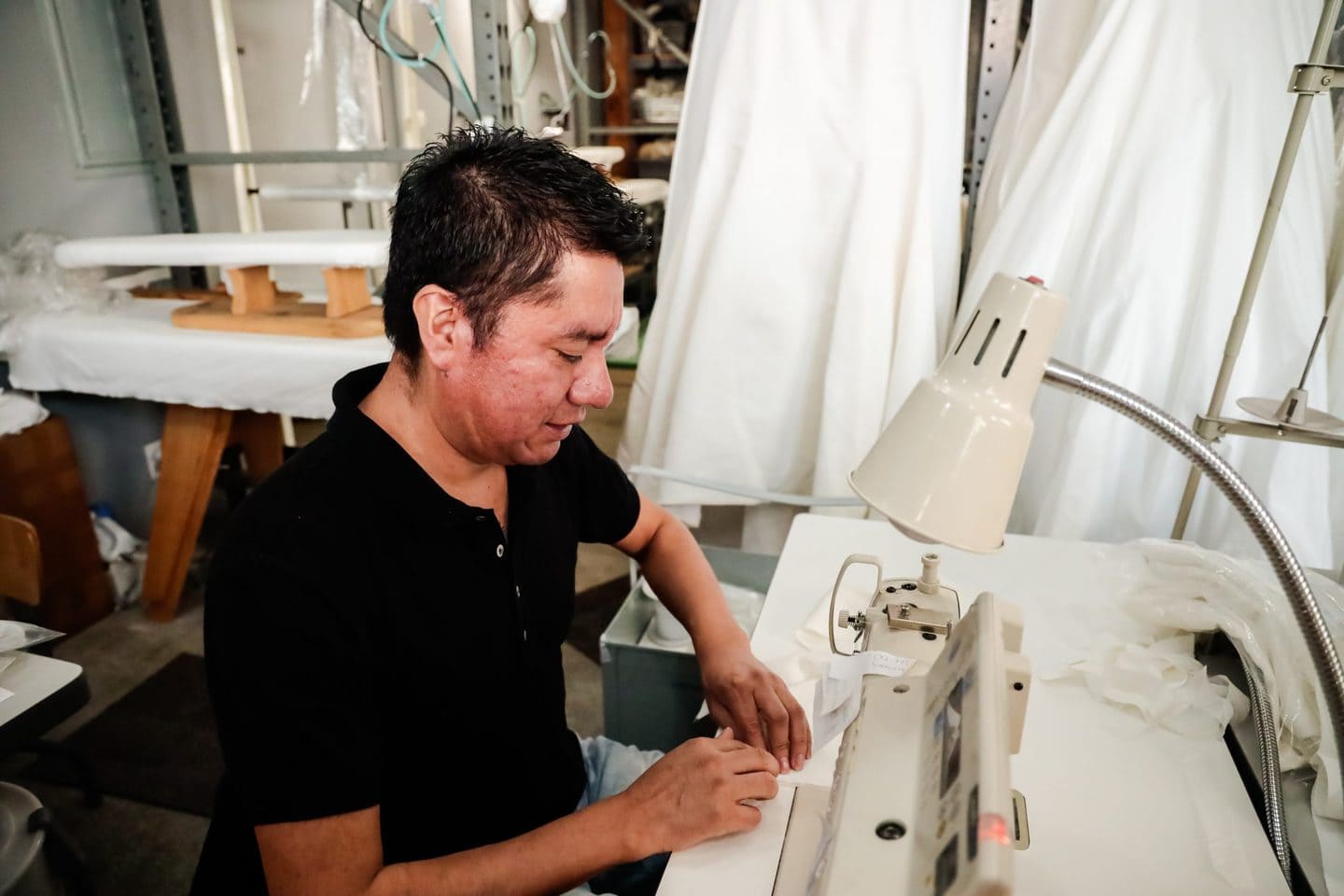 Los Angeles garment manufacturer working at the sewing machine
