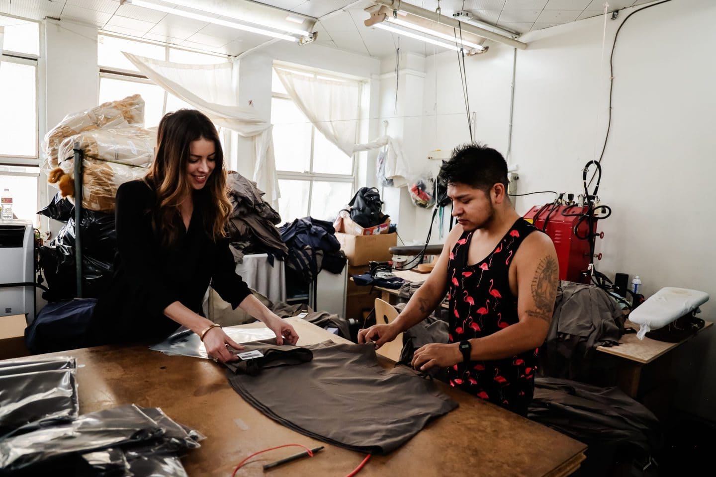 two los angeles designers working on brown fabric used for summer fashion trends