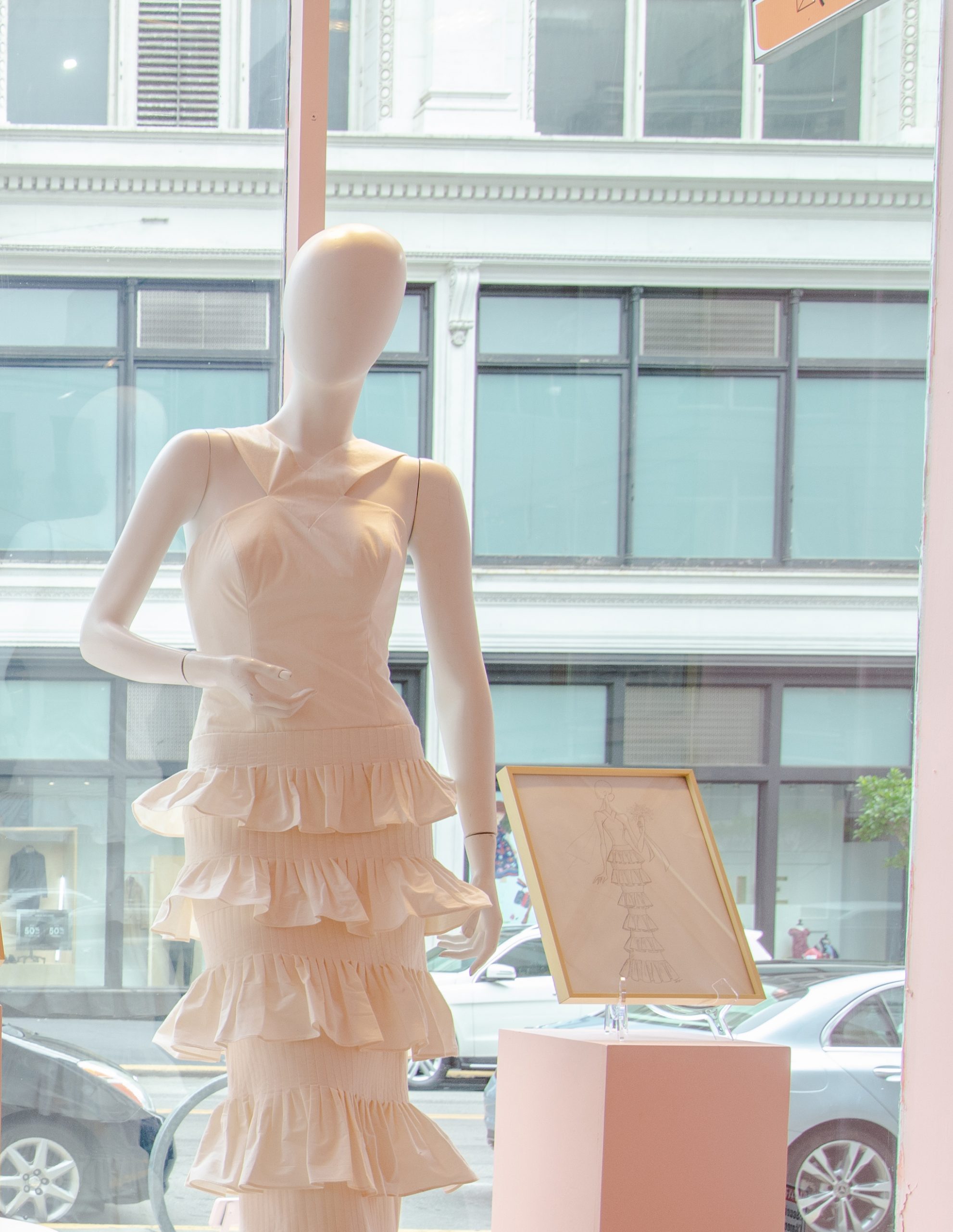 mannequin with haute couture white dress with ruffles