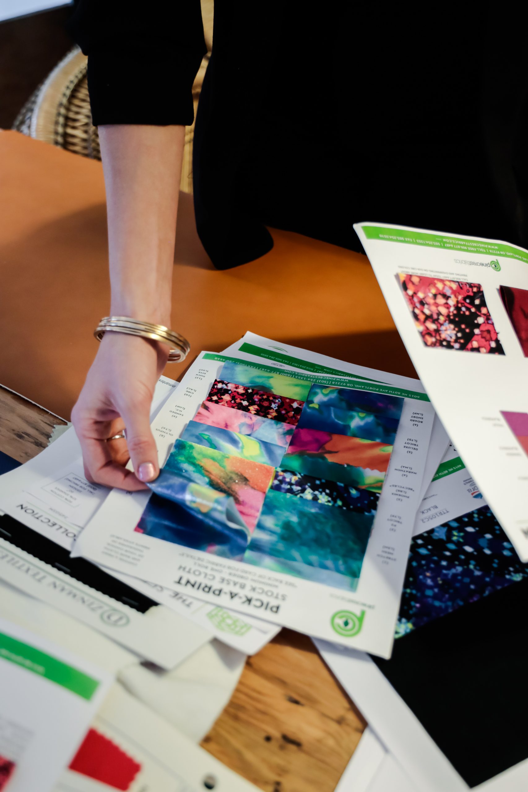 fashion designer going over fabric designs